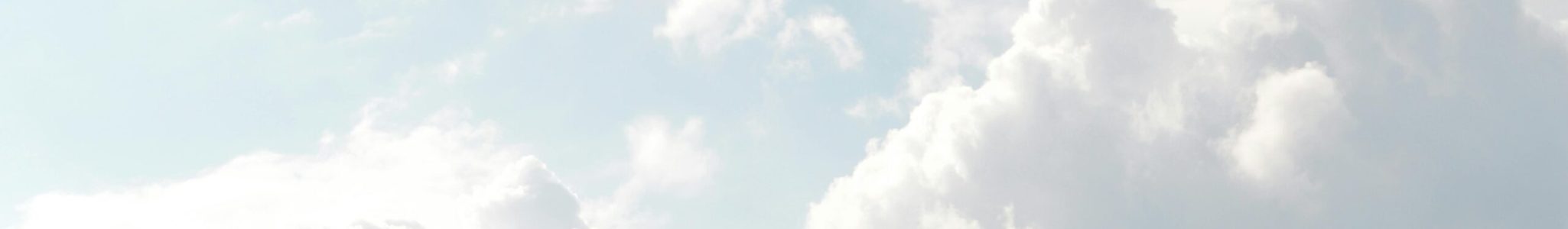 A serene view of thick, fluffy clouds set against a bright blue sky, perfect for backgrounds.